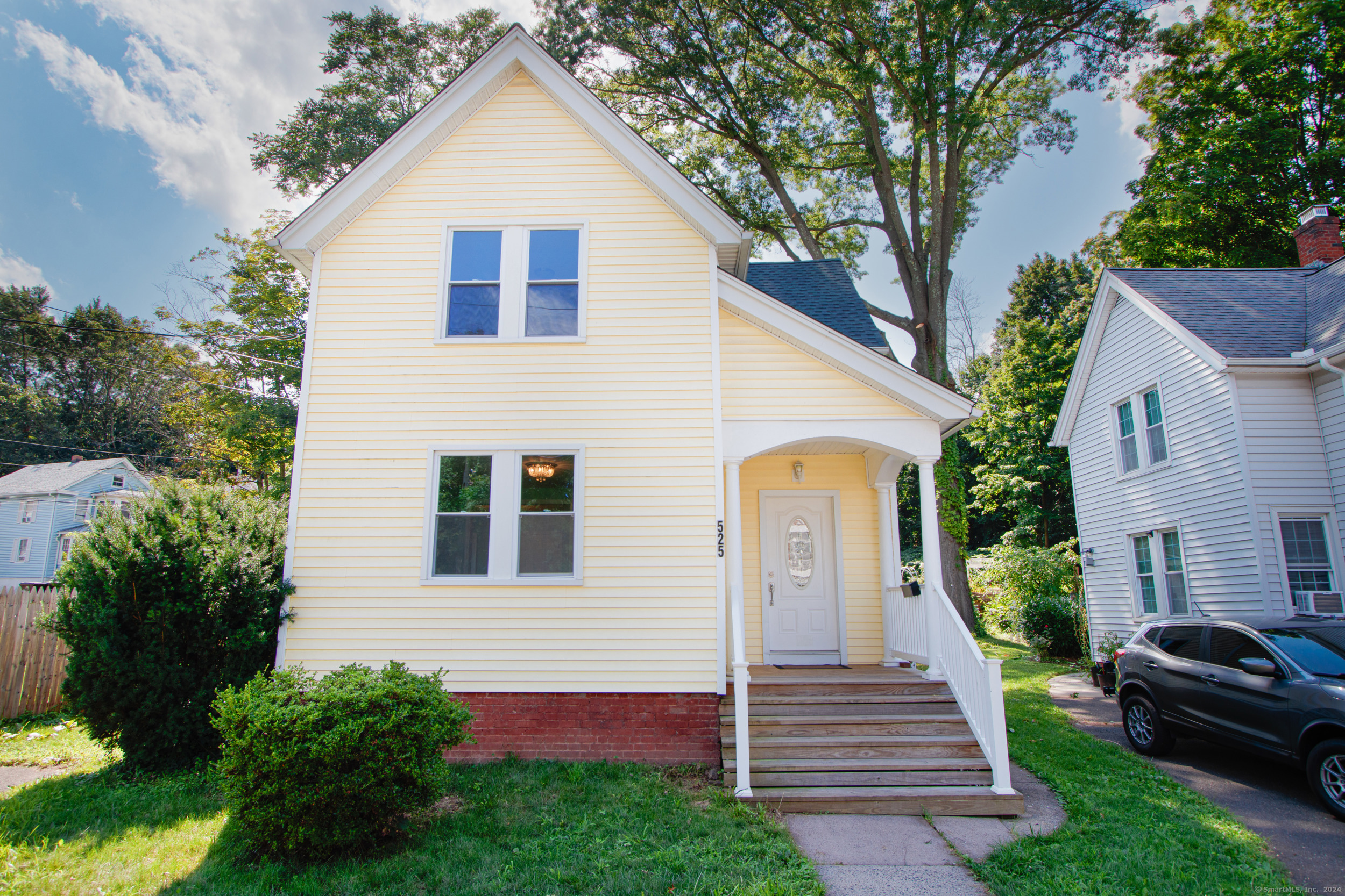 525 High Street Middletown, CT 06457 - Photo 1 of 1 a front view of a house with a garden