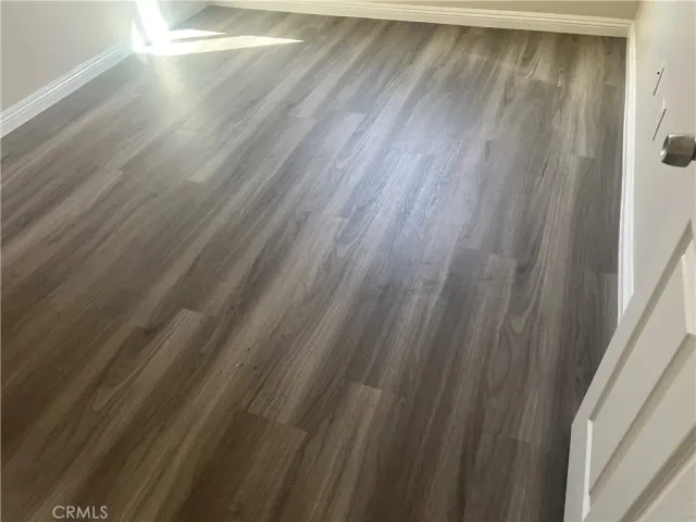 a view of balcony and wooden floor