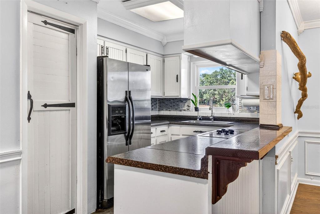 16330 Hanna Road Lutz, FL 33549 - Photo 16 of 41 a kitchen with stainless steel appliances granite countertop a sink stove and refrigerator