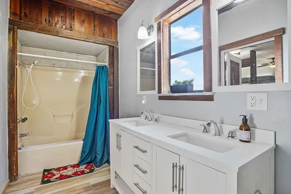 a bathroom with a sink and a bathtub