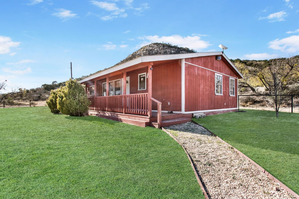 9475 Highway 377 Junction, TX 76849 - Photo 2 of 40 a front view of a house with garden
