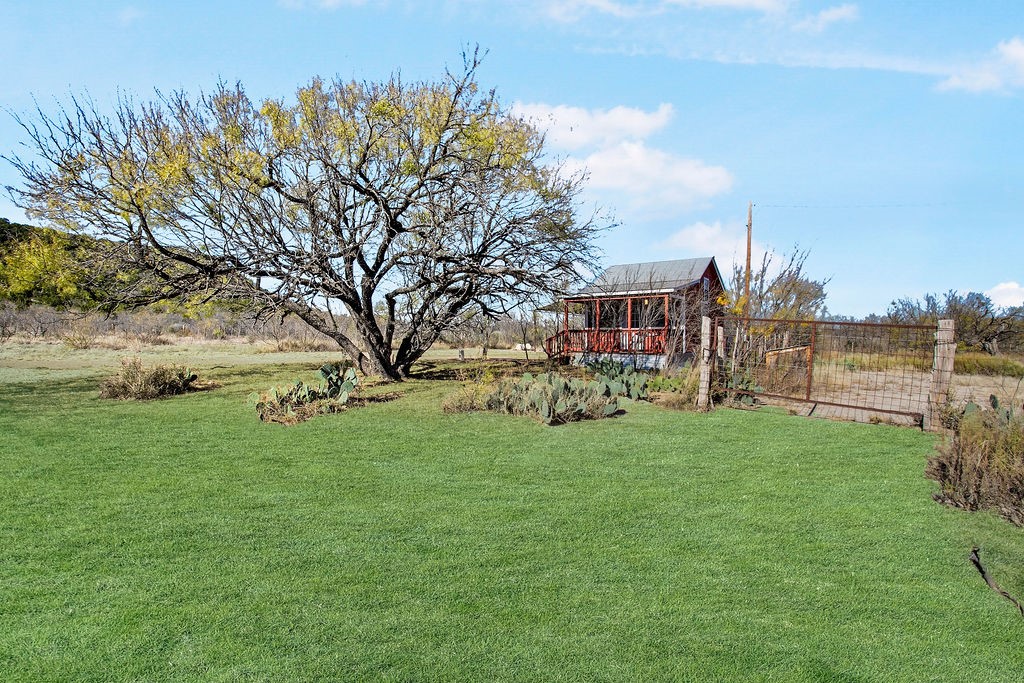 9475 Highway 377 Junction, TX 76849 - Photo 29 of 40 a view of a garden with a building in the background