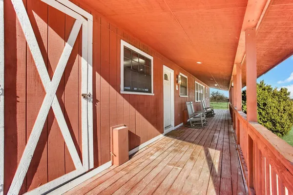 a view of balcony and wooden floor