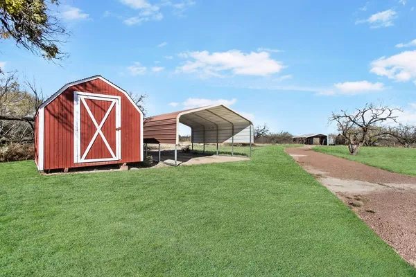 a view of backyard with entertaining space