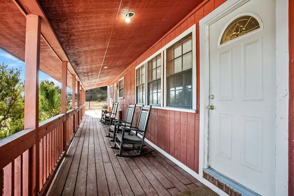 a view of deck with furniture and wooden floor