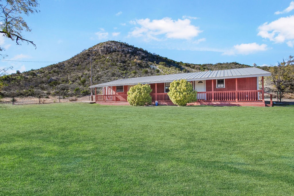 9475 Highway 377 Junction, TX 76849 - Photo 40 of 40 a view of a house with a yard and sitting area