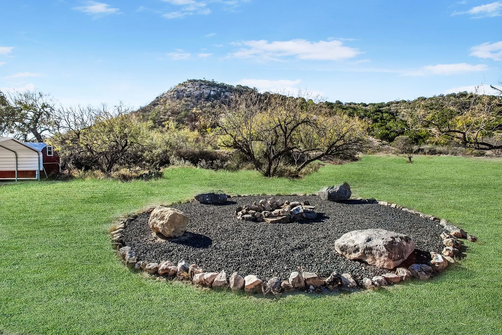 9475 Highway 377 Junction, TX 76849 - Photo 6 of 40 a view of a table and chairs in the garden