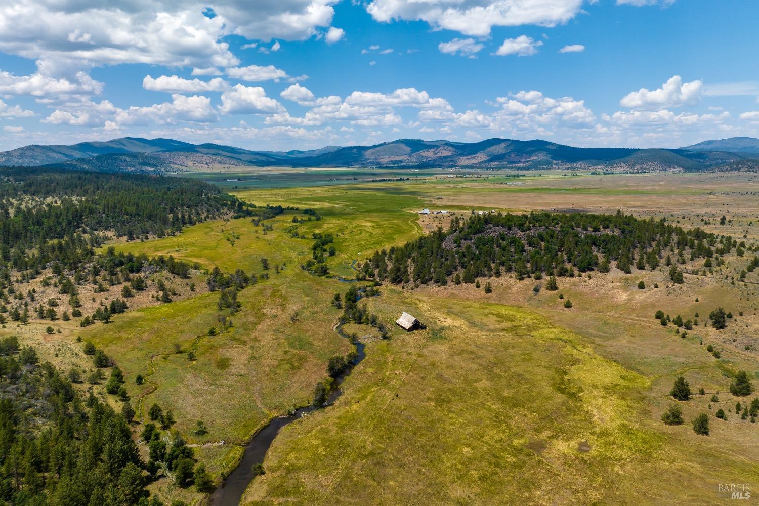 a view of an ocean and a mountain