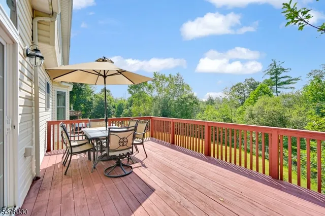 a view of balcony with furniture and wooden floor