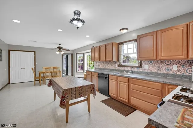 a room with granite countertop furniture and a kitchen view