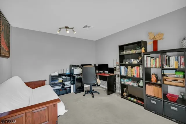 a view of a workspace with furniture