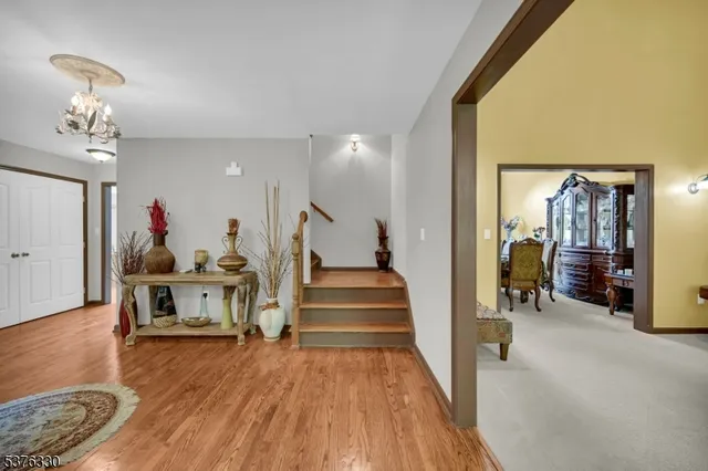 a view of a livingroom with furniture and stairs
