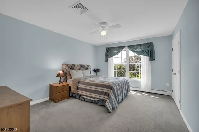 a bed room with a bed and a large window