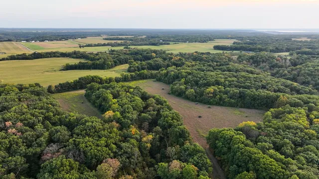 a view of a lake with houses in the background