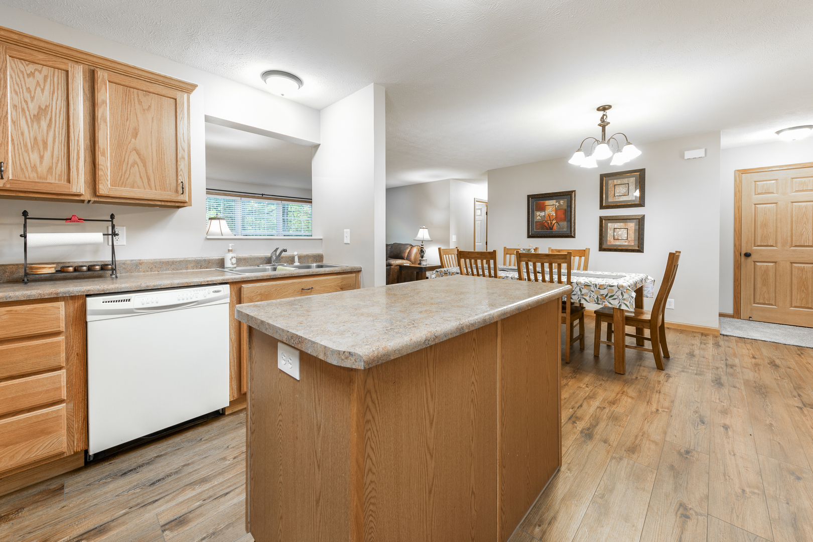 823 Columbia Road Washburn, IL 61570 - Photo 29 of 46 a kitchen with a sink stove and wooden floor