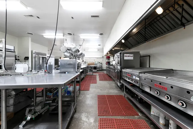 a view of a room with lots of gym equipment