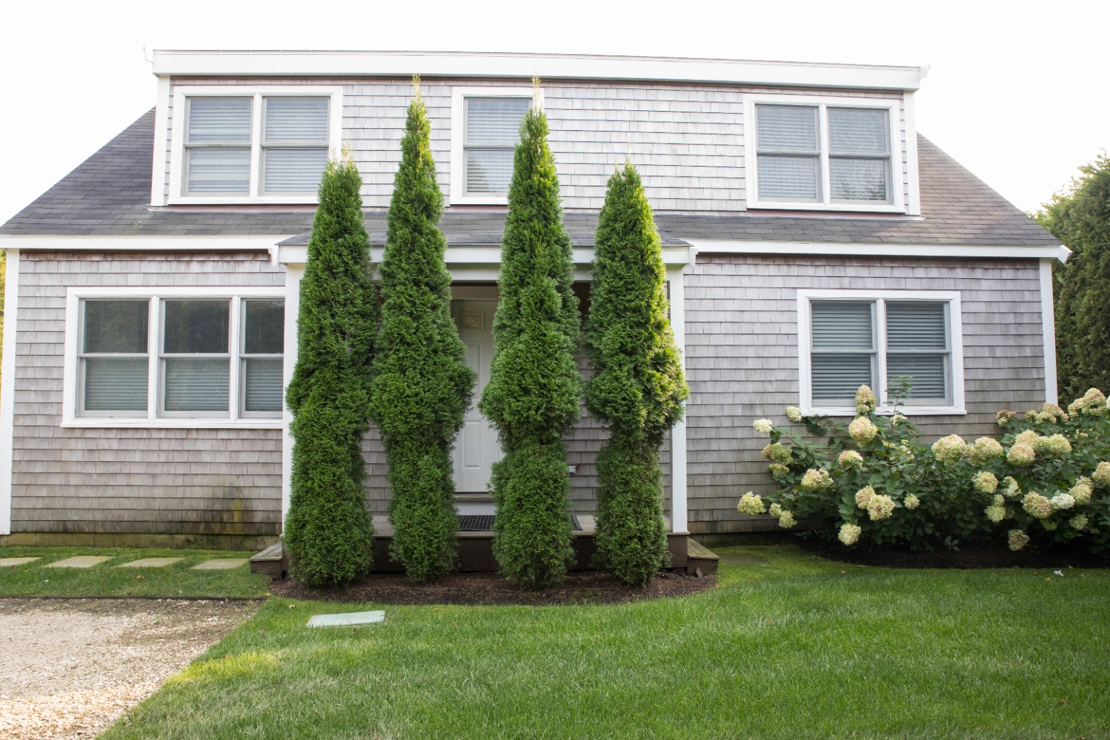 10 Pilgrim Road Nantucket, MA 02554 - Photo 62 of 65 a front view of a house with garden