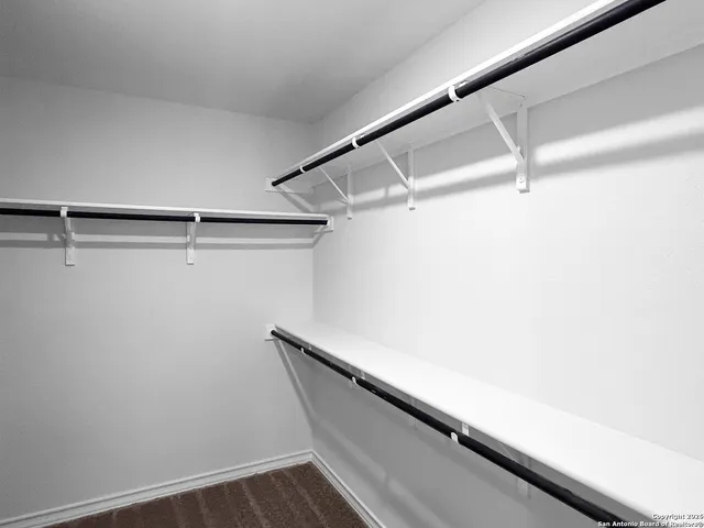 a view of a room with racks on the wall