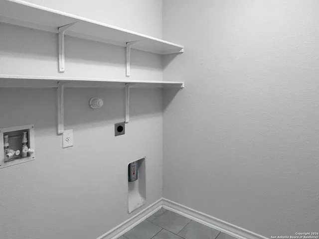 a view of a small space with racks on the wall