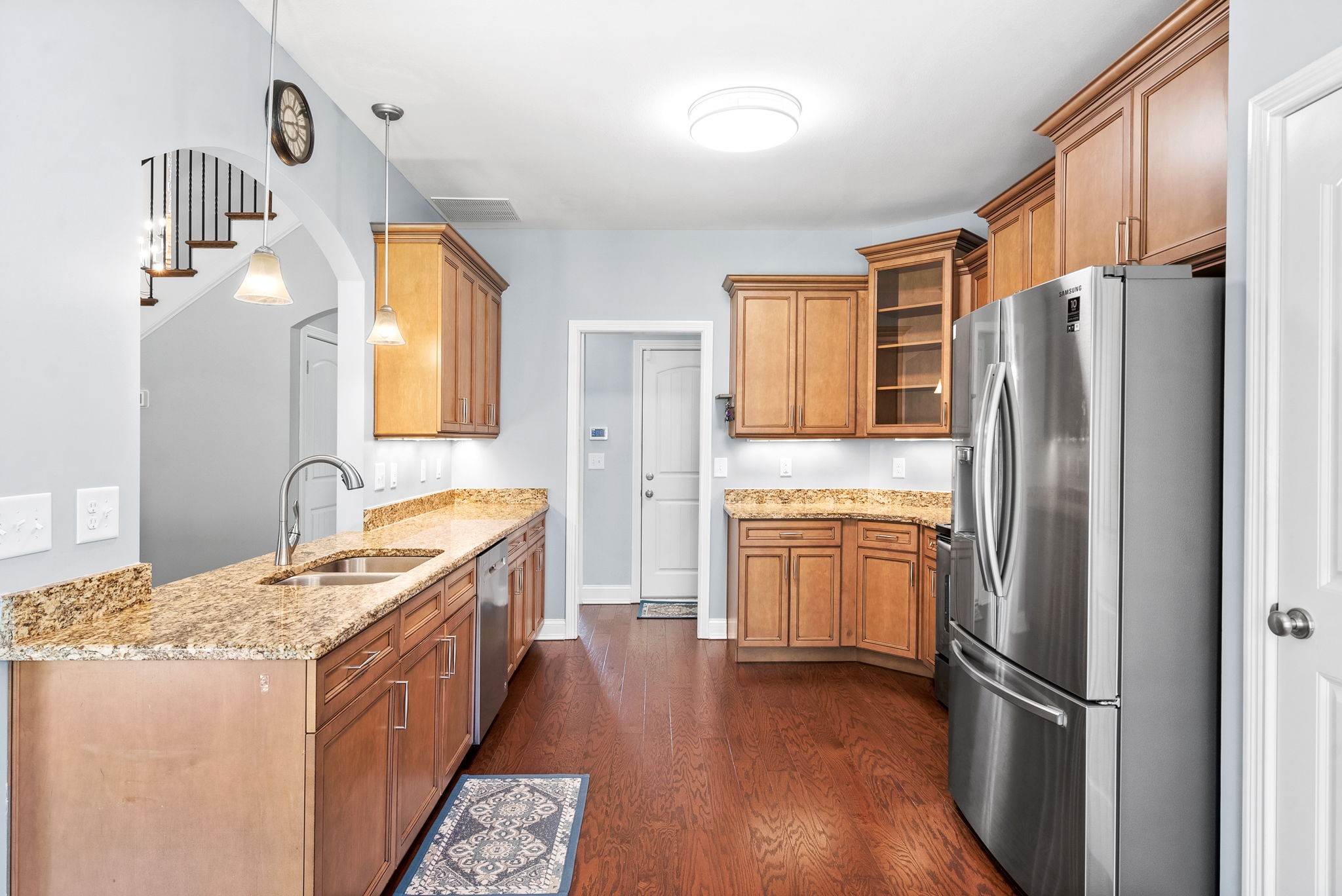 4244 Sango Road Clarksville, TN 37043 - Photo 11 of 43 a kitchen with granite countertop a refrigerator stove and sink