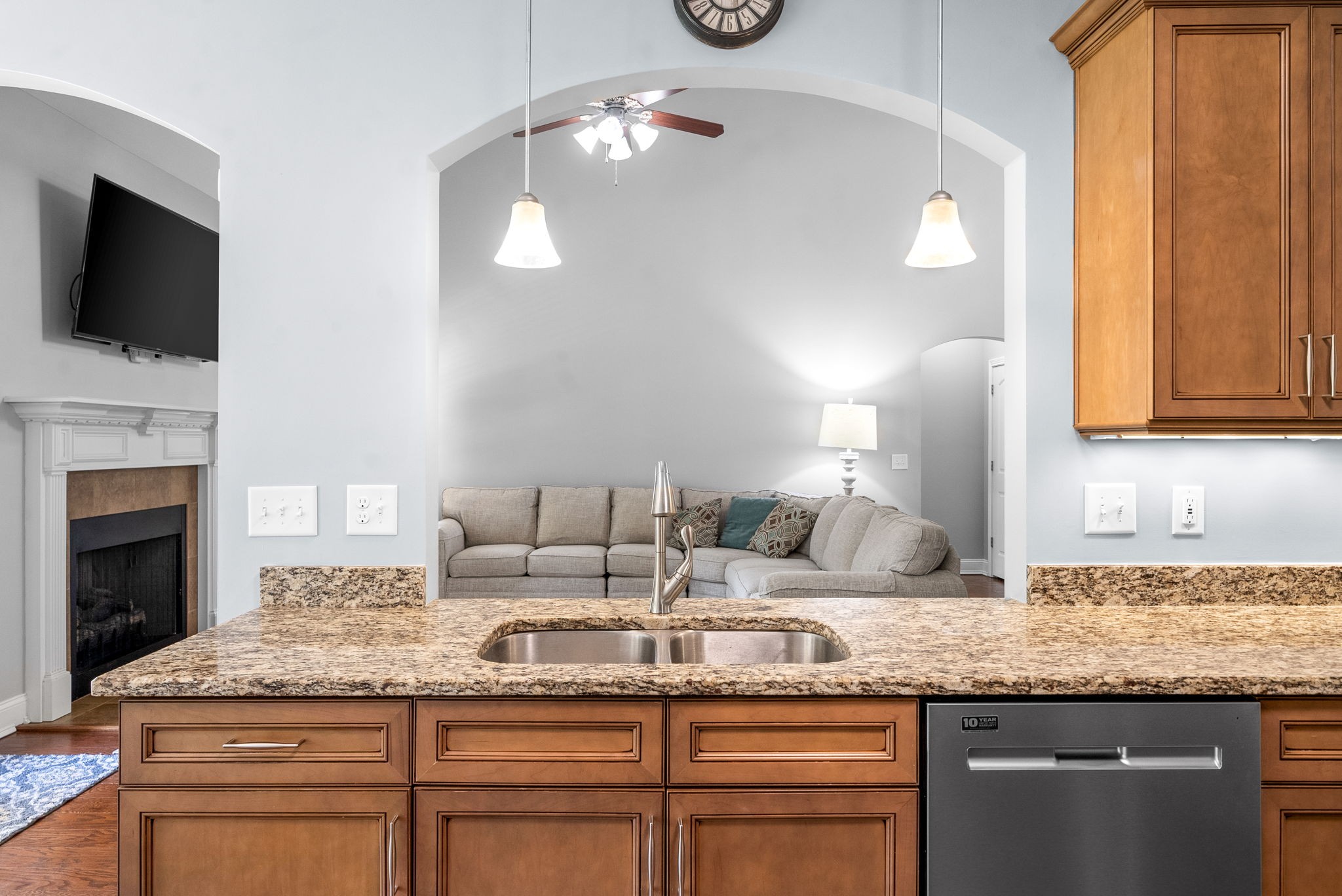 4244 Sango Road Clarksville, TN 37043 - Photo 12 of 43 a kitchen with granite countertop kitchen island white cabinets and stainless steel appliances
