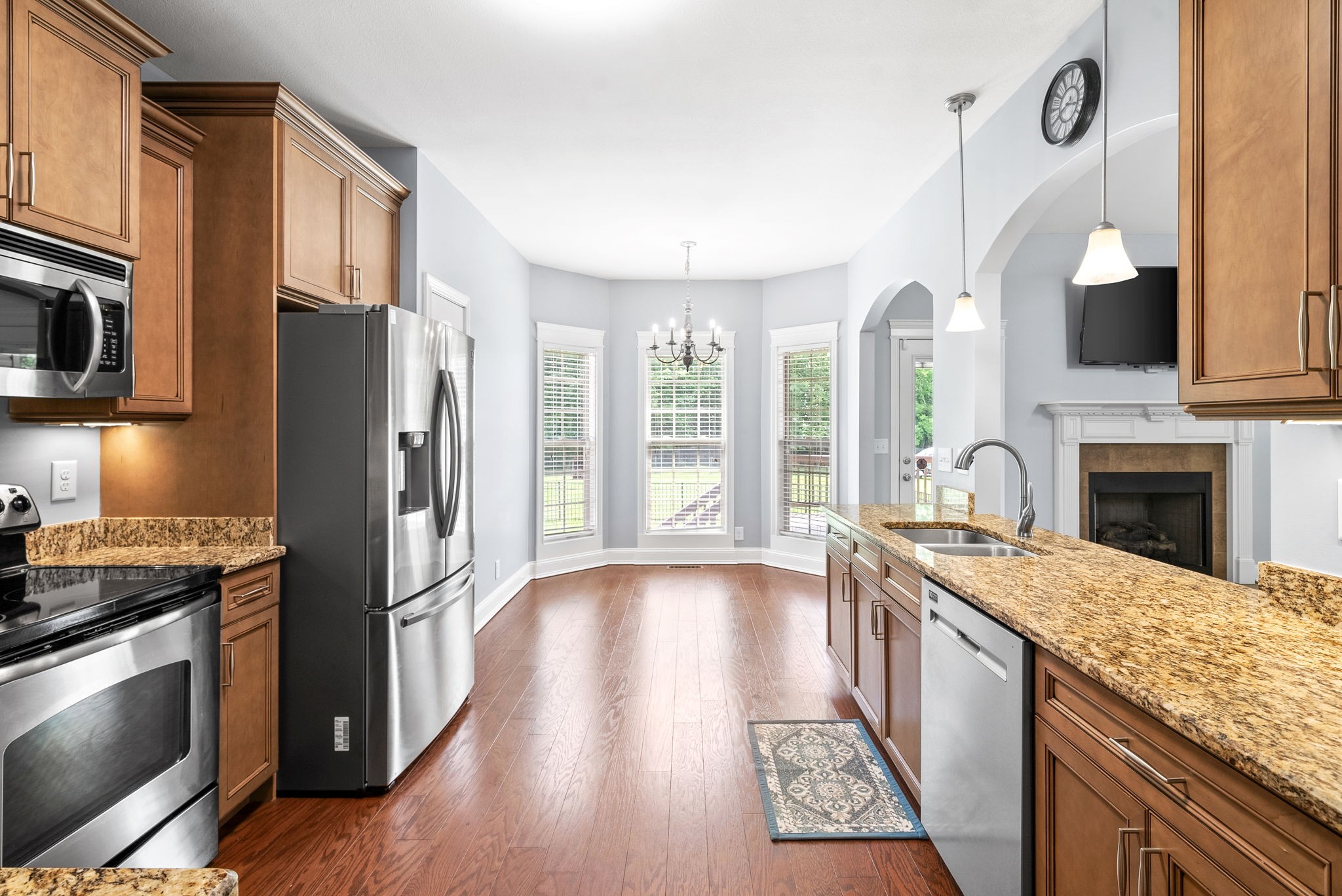 4244 Sango Road Clarksville, TN 37043 - Photo 13 of 43 a kitchen with granite countertop stainless steel appliances a counter space and a window