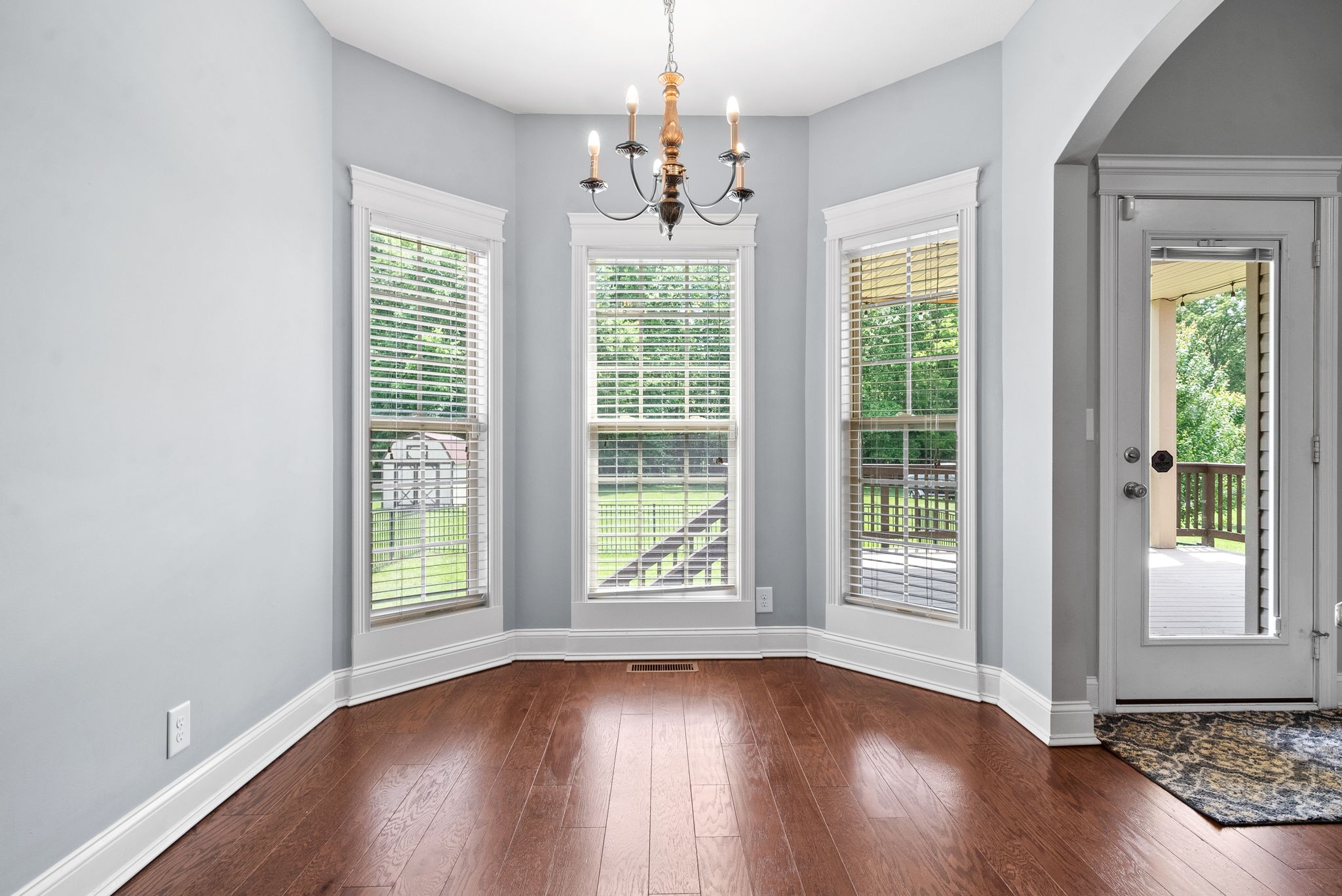 4244 Sango Road Clarksville, TN 37043 - Photo 14 of 43 a view of an empty room with wooden floor and a window