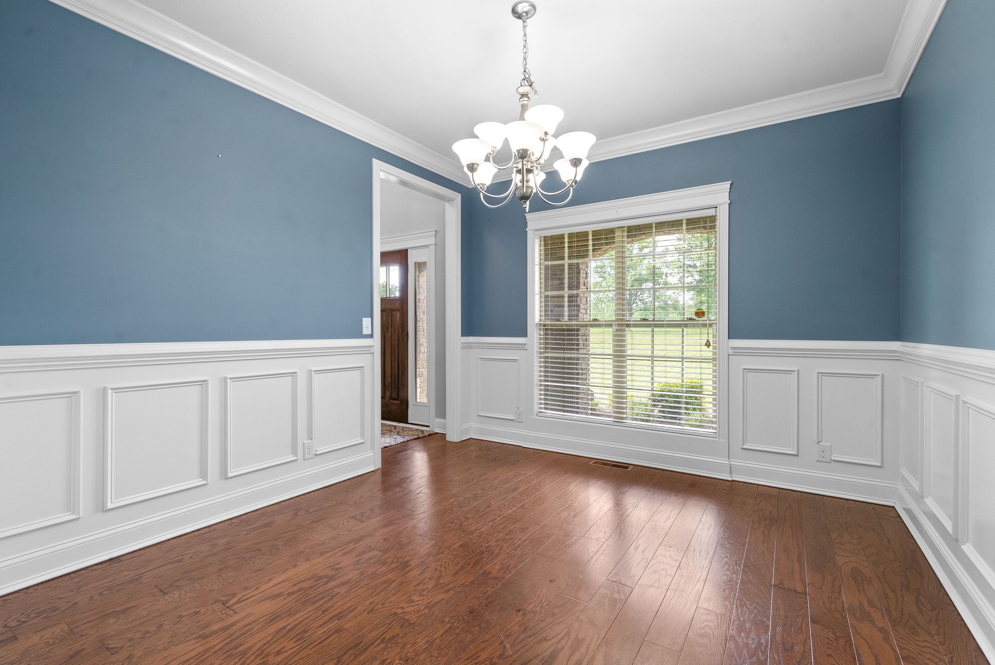 4244 Sango Road Clarksville, TN 37043 - Photo 16 of 43 a view of an empty room with wooden floor and a window