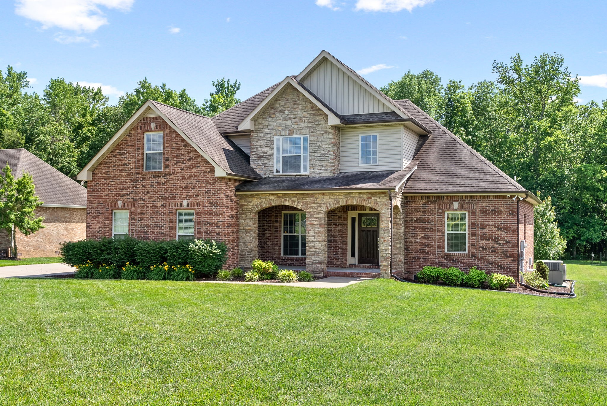 4244 Sango Road Clarksville, TN 37043 - Photo 2 of 43 a front view of a house with garden