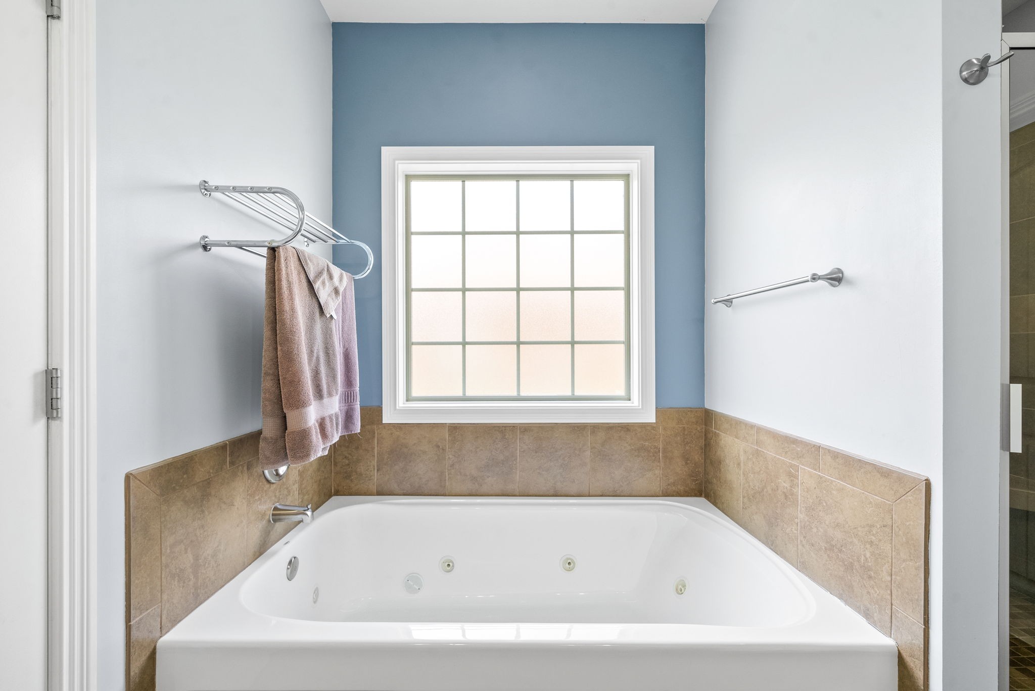 4244 Sango Road Clarksville, TN 37043 - Photo 25 of 43 a white bath tub sitting next to a window
