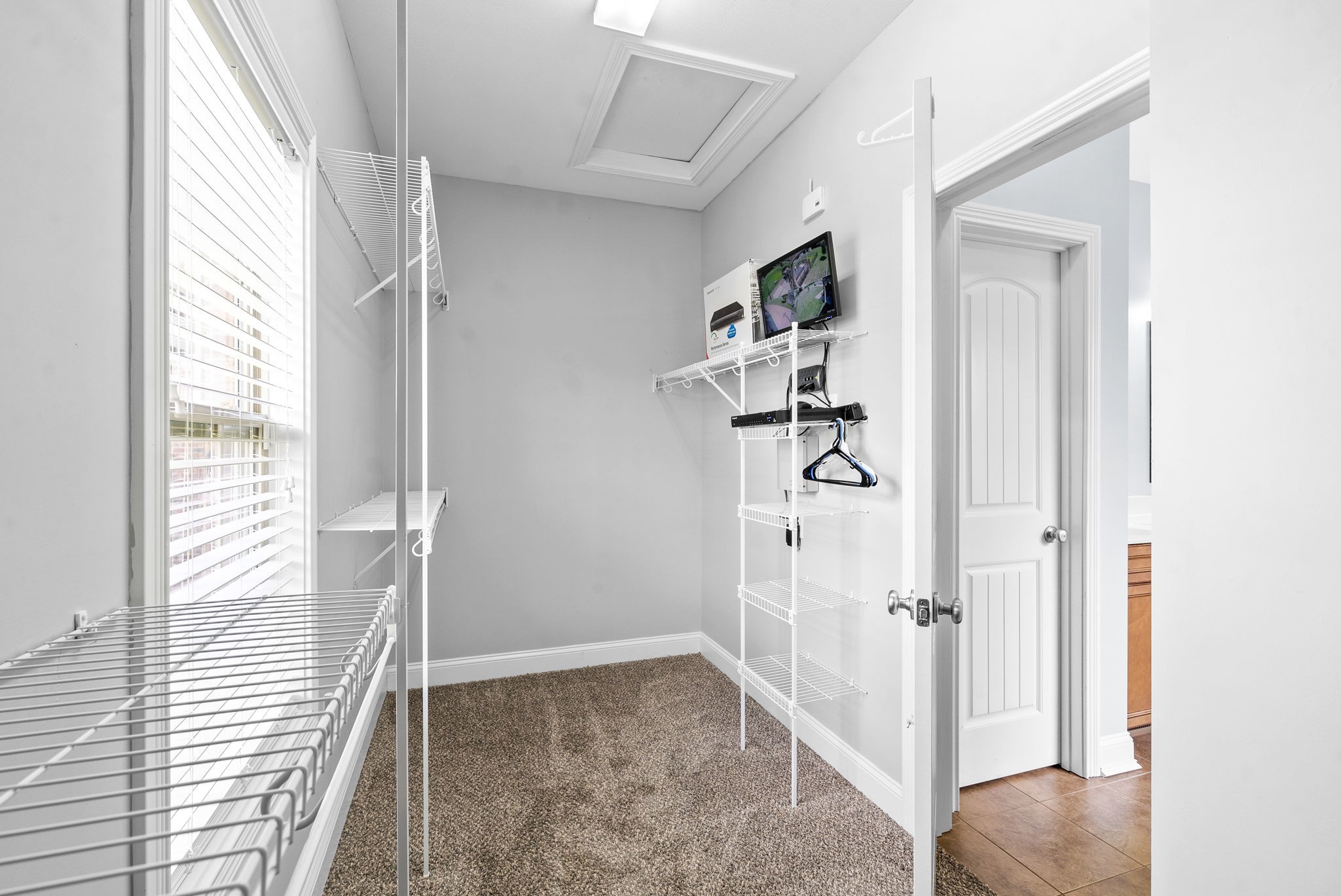4244 Sango Road Clarksville, TN 37043 - Photo 27 of 43 a view of a hallway with wooden floor and entryway