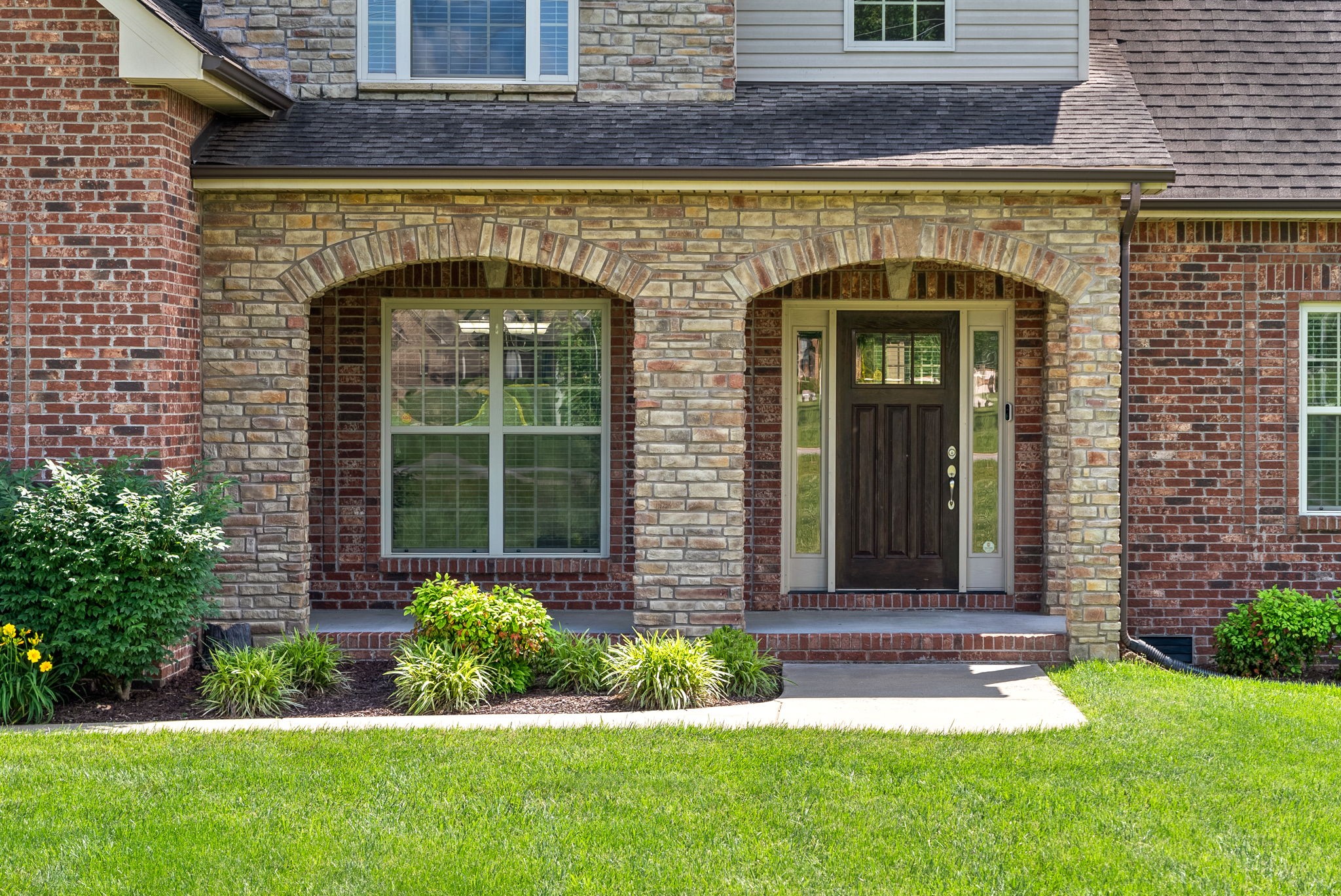 4244 Sango Road Clarksville, TN 37043 - Photo 3 of 43 a front view of a house with garden