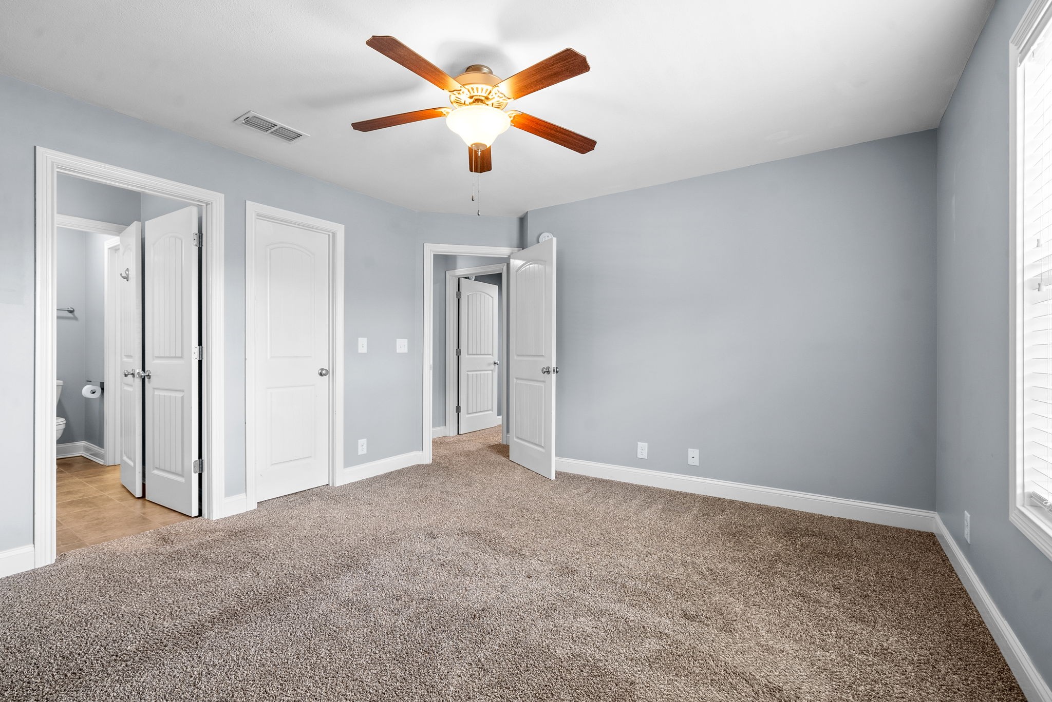 4244 Sango Road Clarksville, TN 37043 - Photo 31 of 43 an empty room with closet and windows