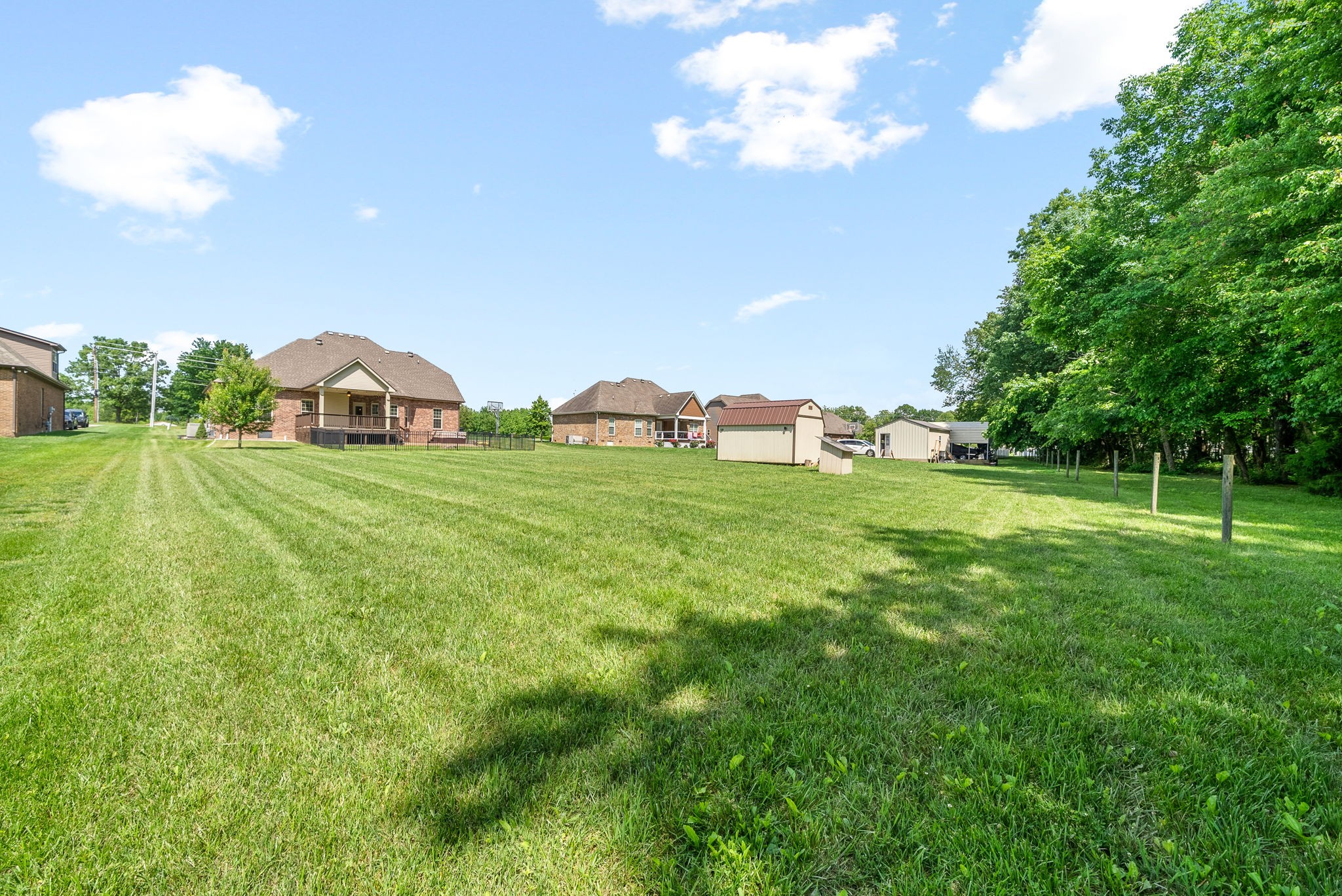 4244 Sango Road Clarksville, TN 37043 - Photo 40 of 43 a view of a green field with large trees