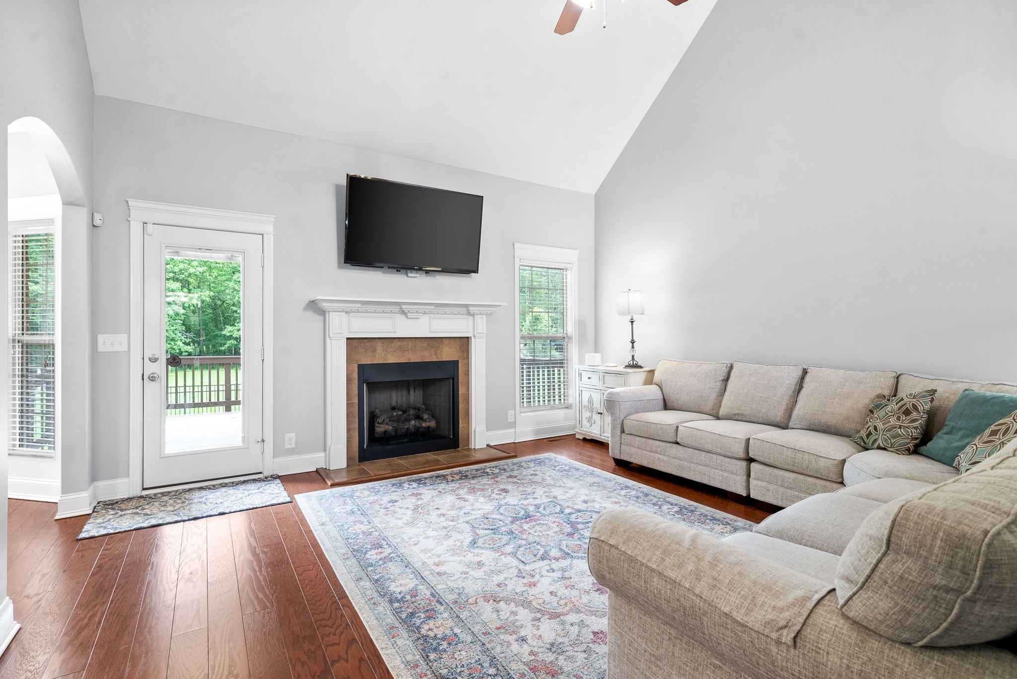 4244 Sango Road Clarksville, TN 37043 - Photo 7 of 43 a living room with furniture a fireplace and a flat screen tv