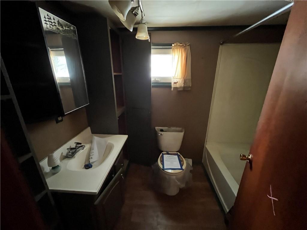 539 5th Street Colver, PA 15927 - Photo 8 of 13 a bathroom with a sink a toilet a mirror and vanity