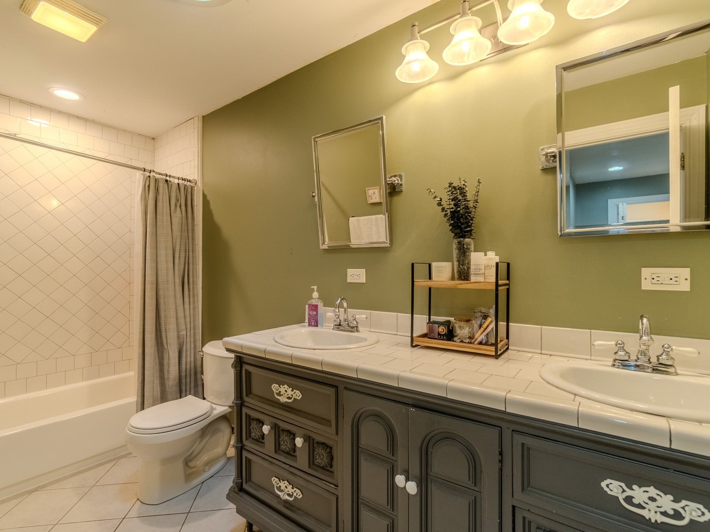 215 North River Road Fox River Grove, IL 60021 - Photo 17 of 25 a bathroom with a sink a toilet and shower