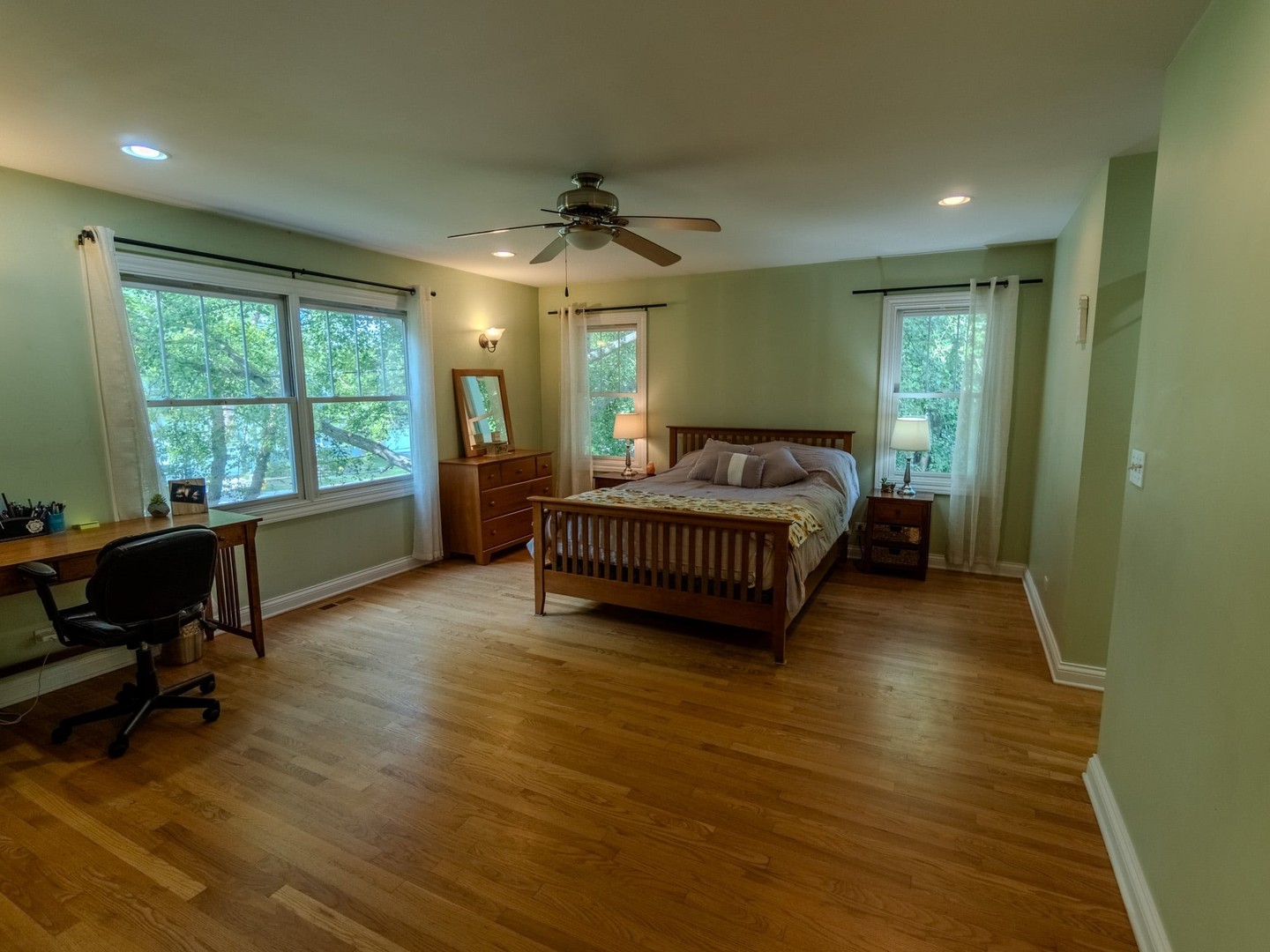 215 North River Road Fox River Grove, IL 60021 - Photo 19 of 25 a spacious bedroom with a bed and a chair