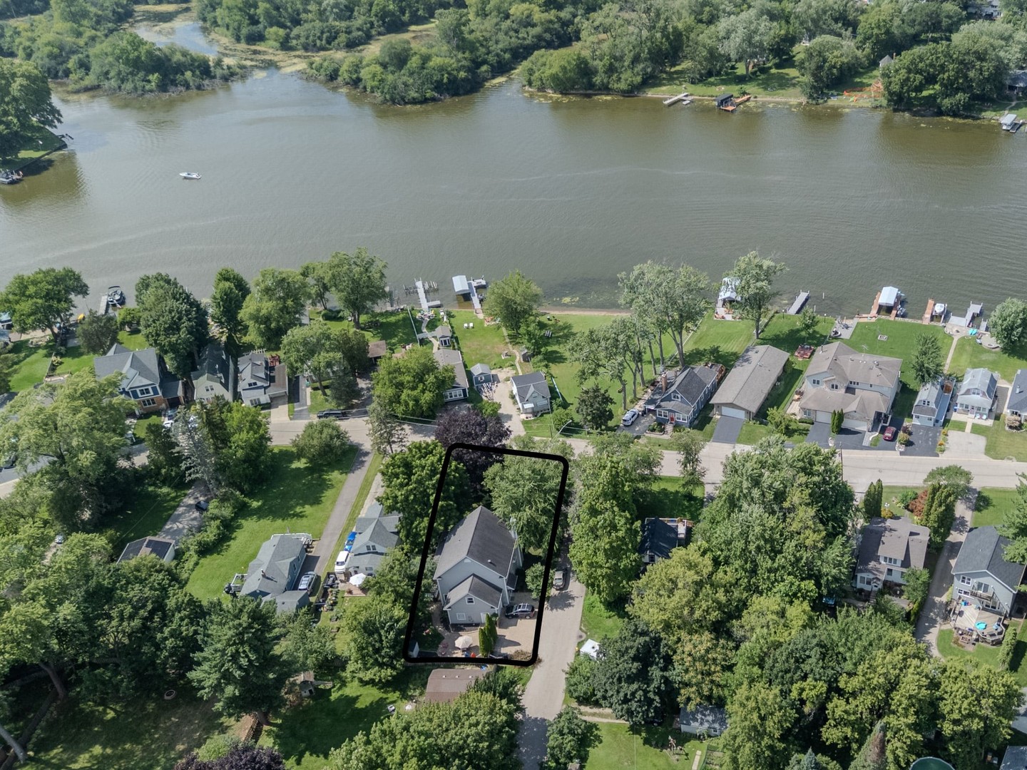 215 North River Road Fox River Grove, IL 60021 - Photo 2 of 25 an aerial view of a house with a yard and lake view