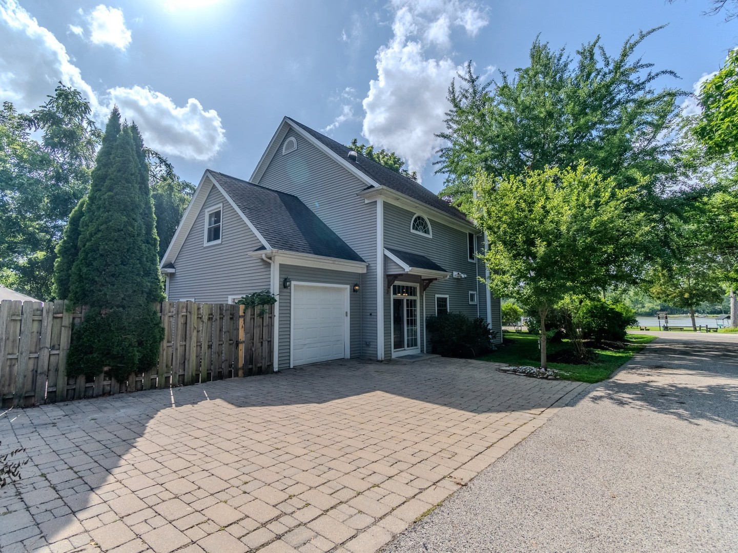 215 North River Road Fox River Grove, IL 60021 - Photo 4 of 25 a front view of a house with a yard and garage