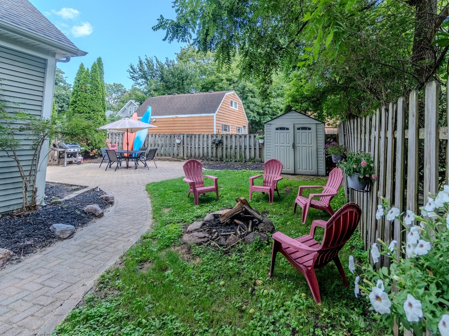 215 North River Road Fox River Grove, IL 60021 - Photo 5 of 25 a garden with plants and outdoor seating