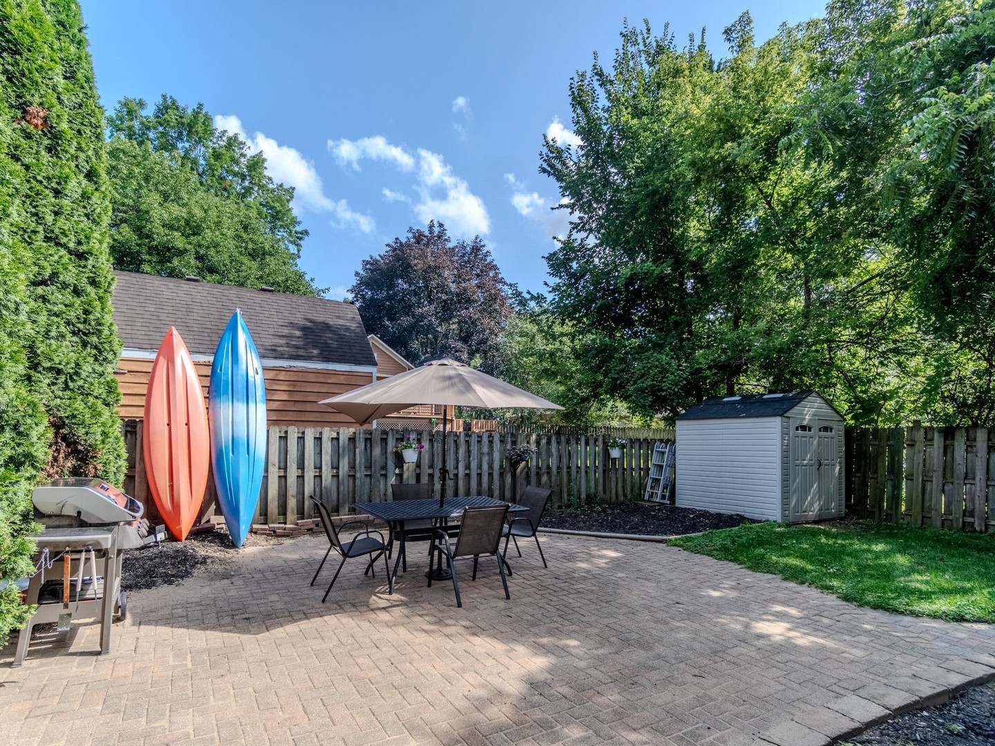215 North River Road Fox River Grove, IL 60021 - Photo 6 of 25 a view of backyard with a patio and outdoor seating