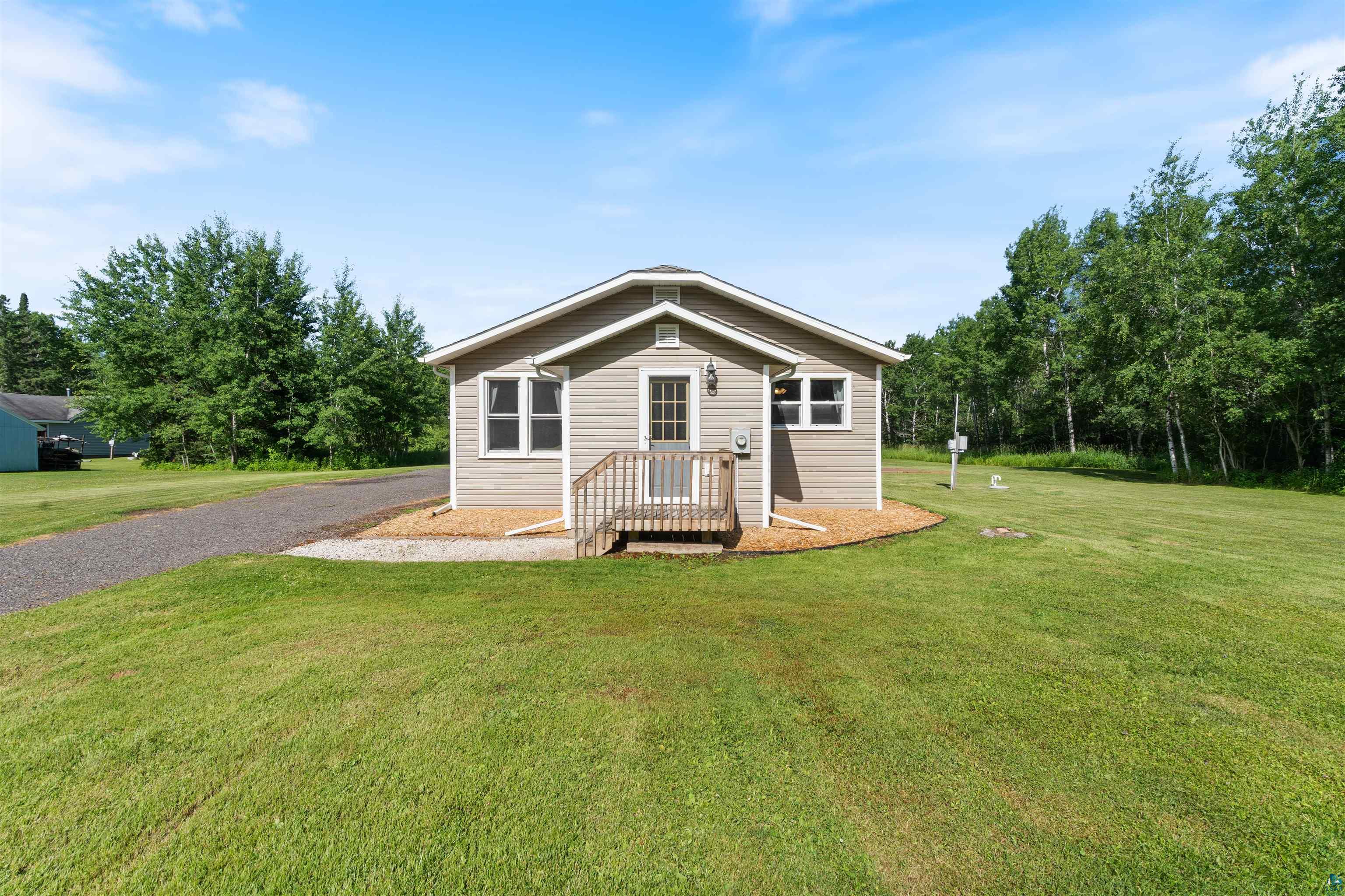 3835 South County Rd K South Range, WI 54874 - Photo 2 of 29 Single-story residence featuring light gray siding, white trim, and a gabled roof