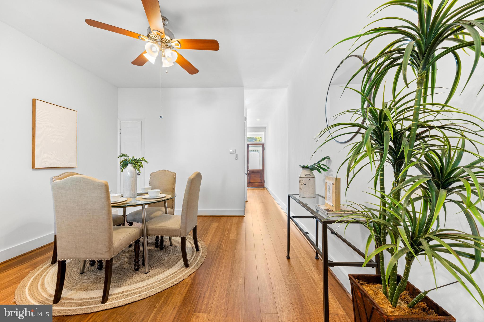 3353 Beech Avenue Baltimore, MD 21211 - Photo 11 of 32 a view of a dining room with furniture and a potted plant