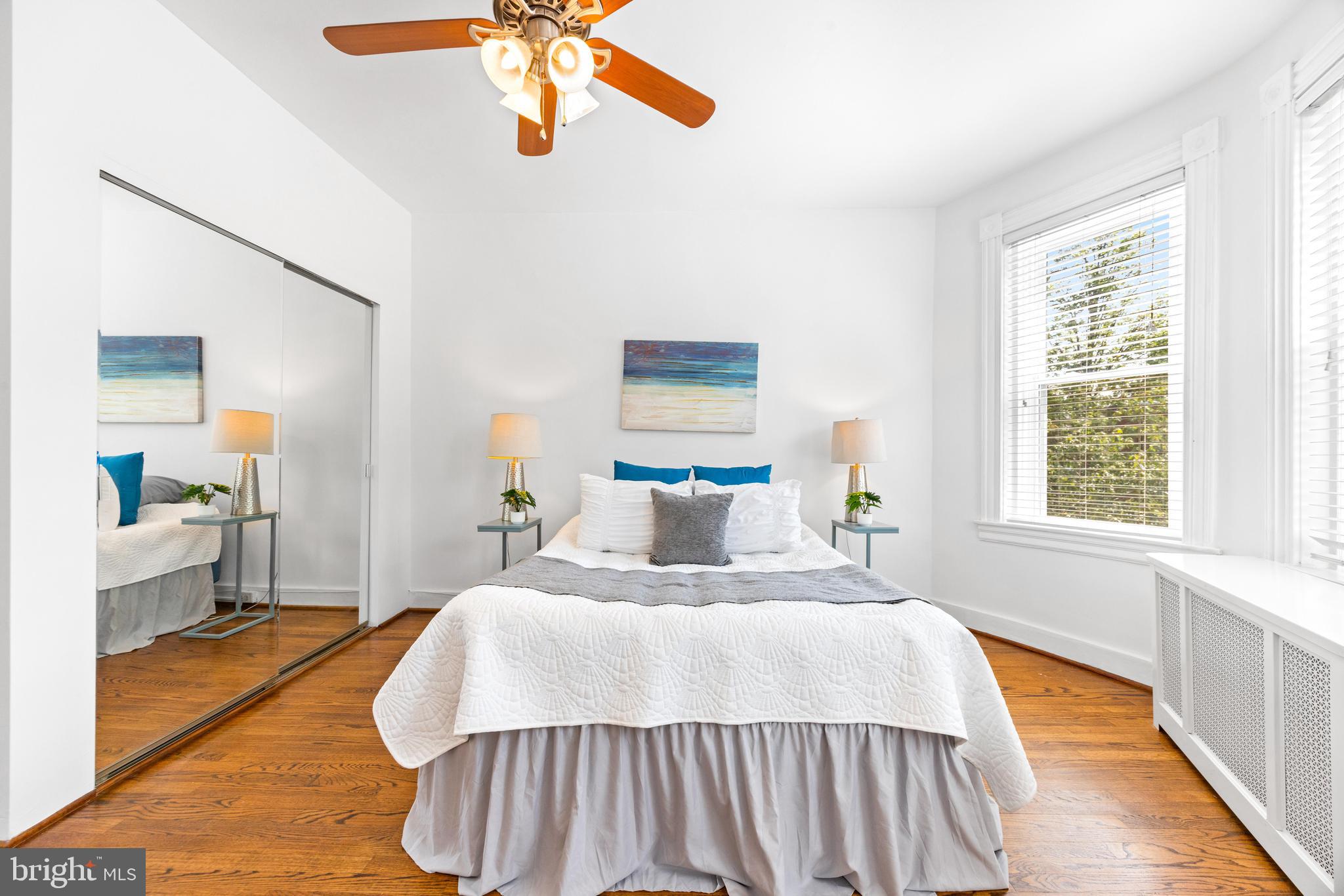 3353 Beech Avenue Baltimore, MD 21211 - Photo 17 of 32 a bedroom with a bed and a chandelier