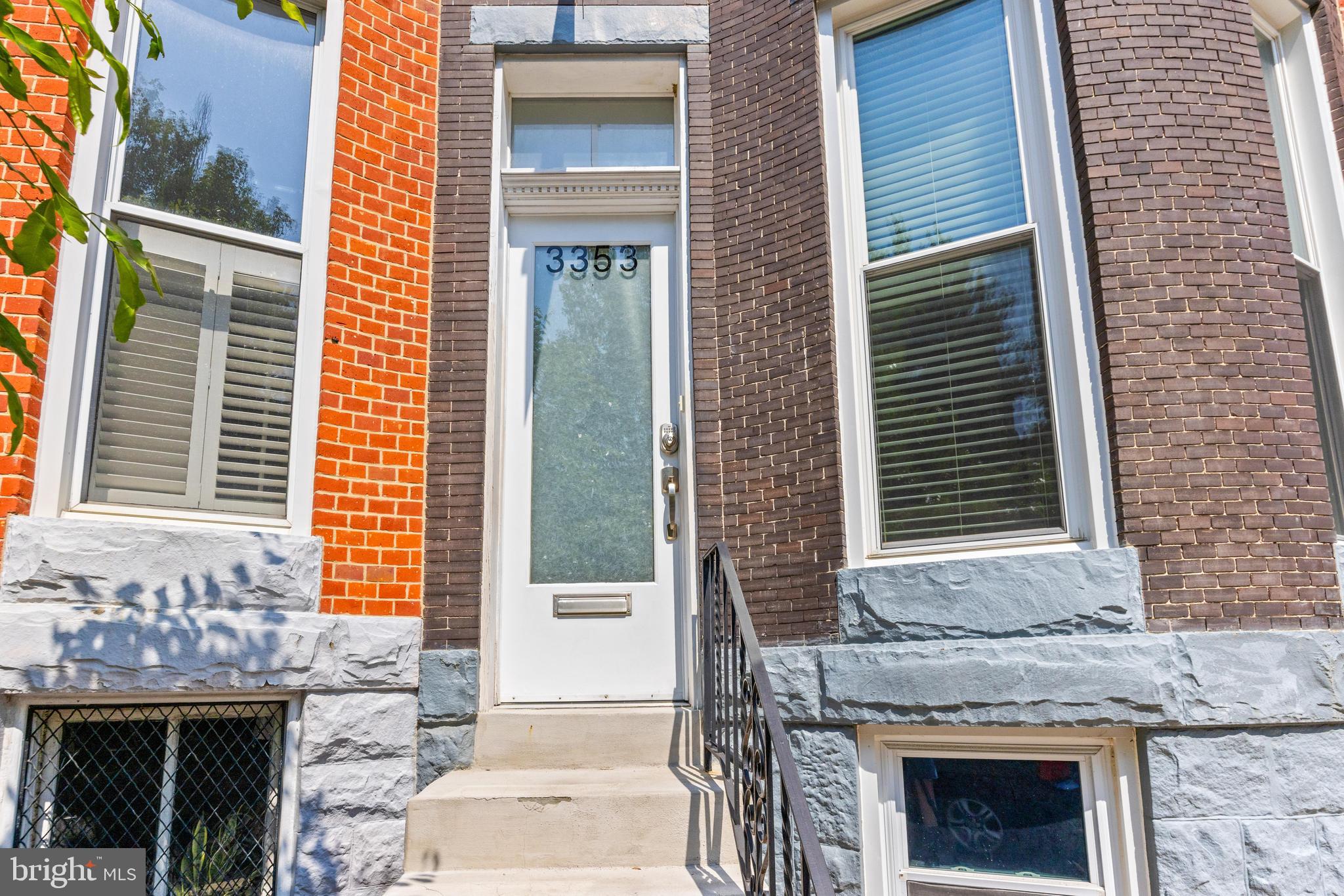 3353 Beech Avenue Baltimore, MD 21211 - Photo 2 of 32 a front view of a house with a yard