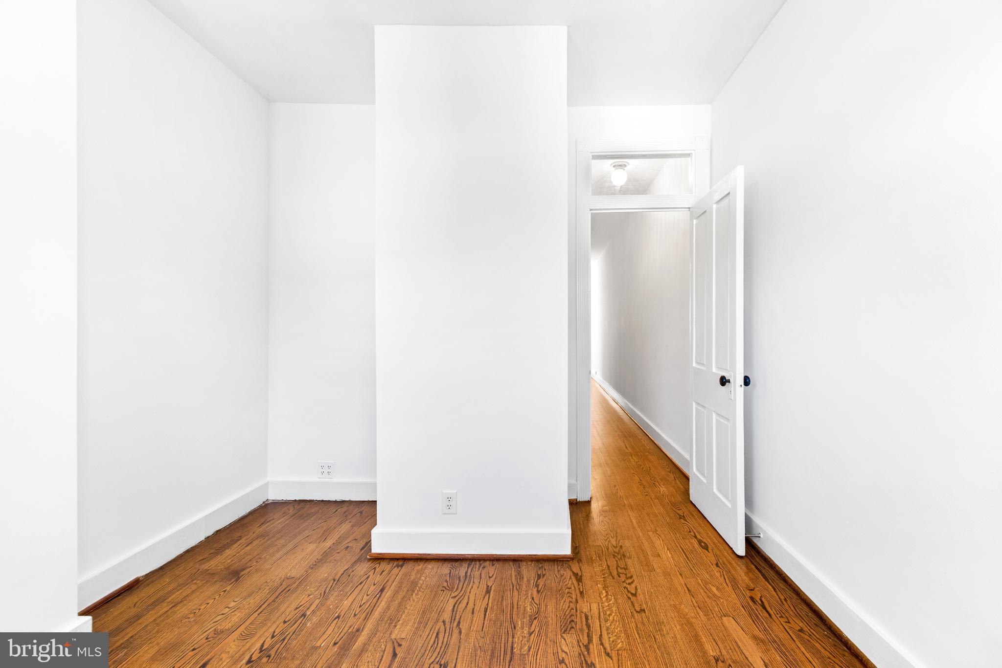 3353 Beech Avenue Baltimore, MD 21211 - Photo 24 of 32 a view of a hallway with wooden floor