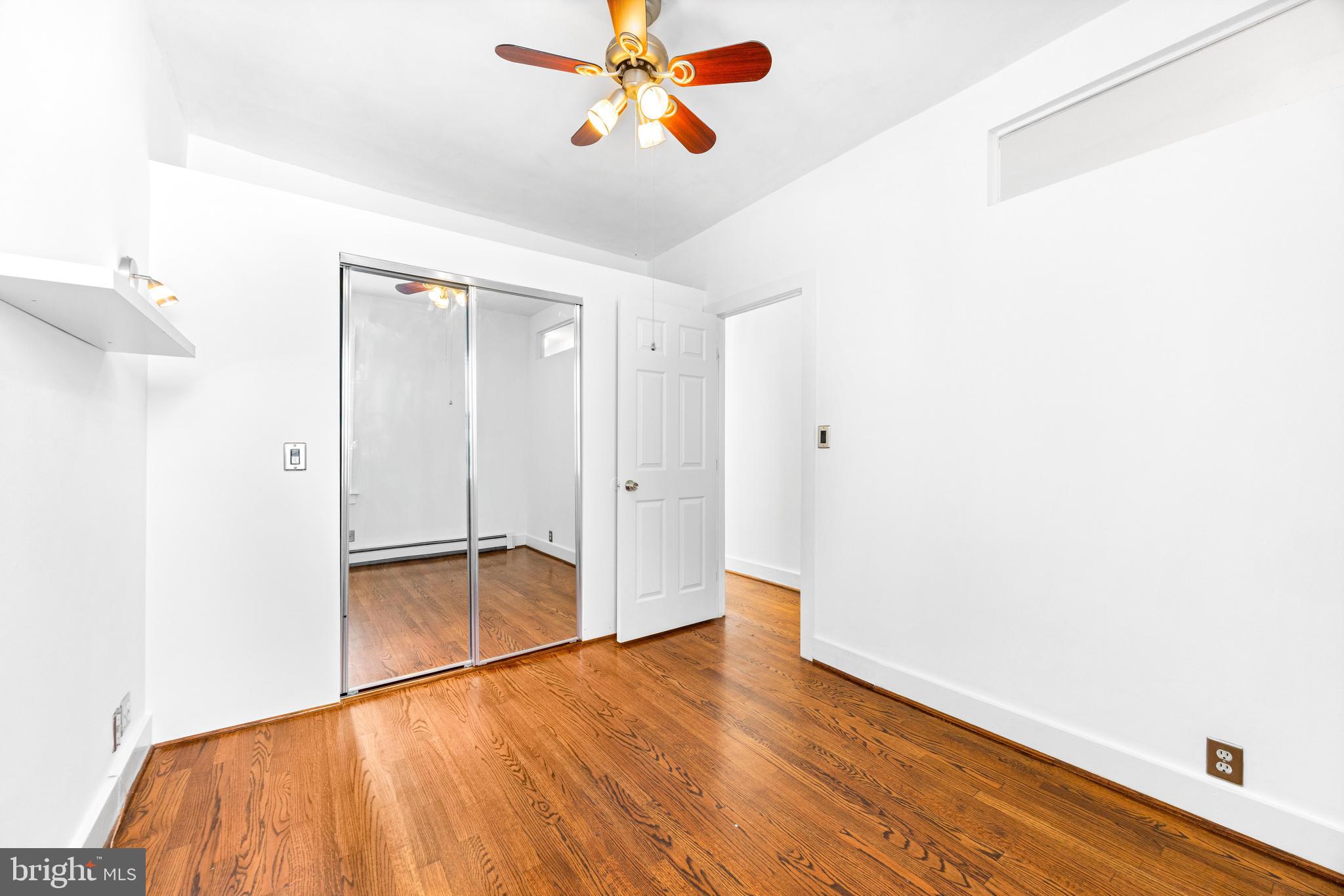 3353 Beech Avenue Baltimore, MD 21211 - Photo 26 of 32 a view of empty room with wooden floor
