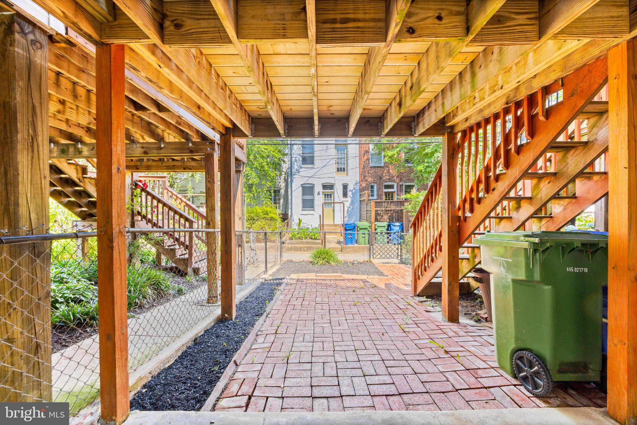 3353 Beech Avenue Baltimore, MD 21211 - Photo 30 of 32 a view of a porch with wooden floor and stairs