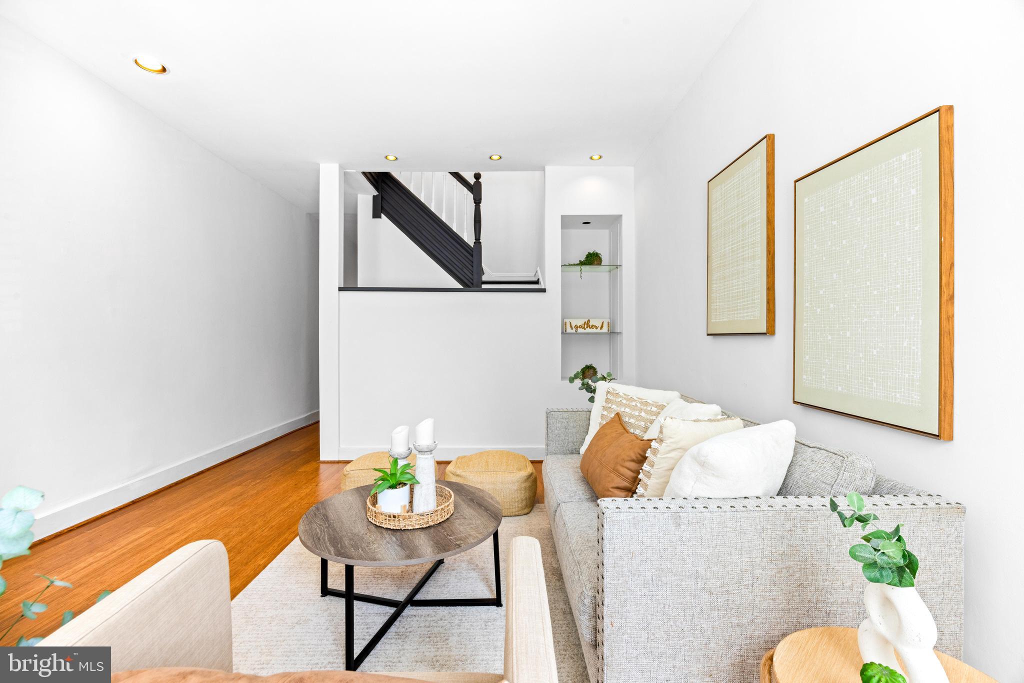 3353 Beech Avenue Baltimore, MD 21211 - Photo 4 of 32 a living room with furniture and a potted plant